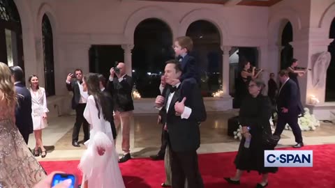 Elon Musk and his son Lil X at Trump's New Year's Eve party at Mar-a-Lago.