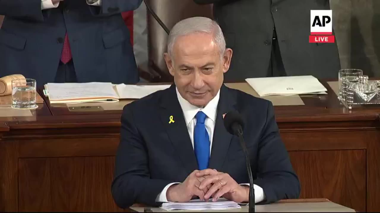 US Congress gave a standing ovation and shook hands of a man who has murdered half a million people