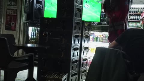 Man Carries Five Full Cases on His Shoulder