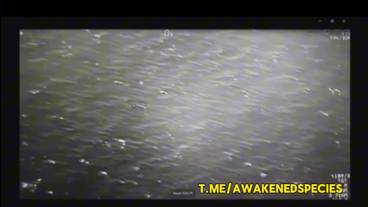 Military surveillance video shows a UFO splitting a Hellfire missile in mid air.