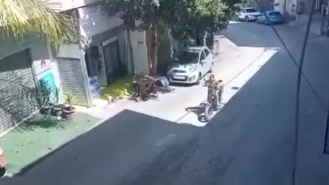 Israeli armored vehicles chase a Palestinian child during a raid on Al Yamoun town, west of Jenin