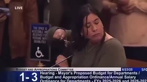 Woman CUTS her hair to protest budget cuts in San Francisco..