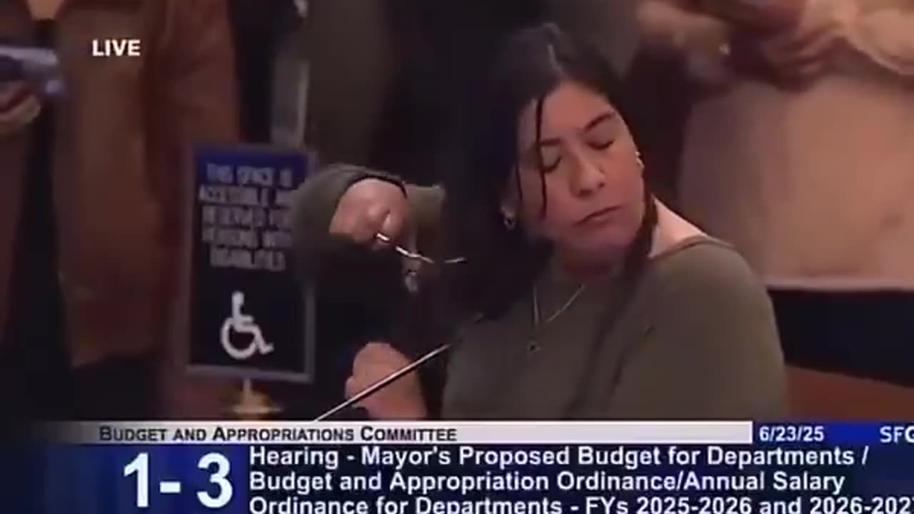 Woman CUTS her hair to protest budget cuts in San Francisco..