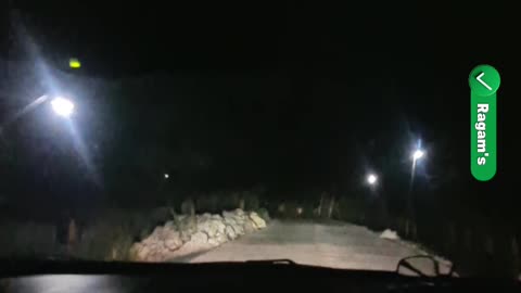 Driving At Night Across A Deserted Forest