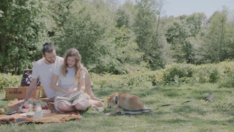 Couple Picnic and their dog, enjoying a beautiful day