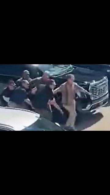 Brian Harpole & security team carrying Charlie Kirk's body to vehicle