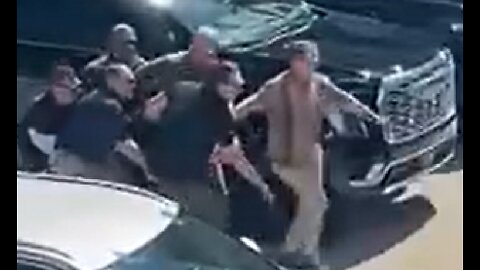 Brian Harpole & security team carrying Charlie Kirk's body to vehicle