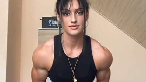Beautiful muscle girl flexing