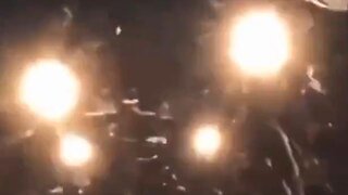 Four massive Orbs pass over a semi truck: at first it looks like another semi coming head on