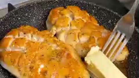 Chicken fillet in sauce in a frying pan