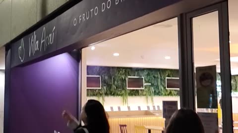 Woman Walks Into Glass of a Snack Bar