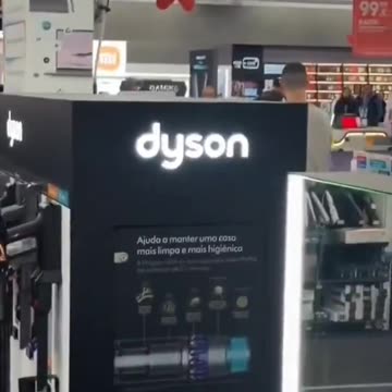 A man with a hammer destroys numerous televisions and computers in a shopping