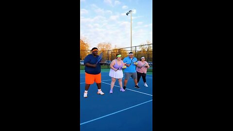 Joseph Martelli and friends practice tennis with a racquet in one hand and cake in the other