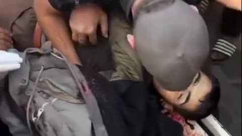 A young man mourns the martyrdom of his brother