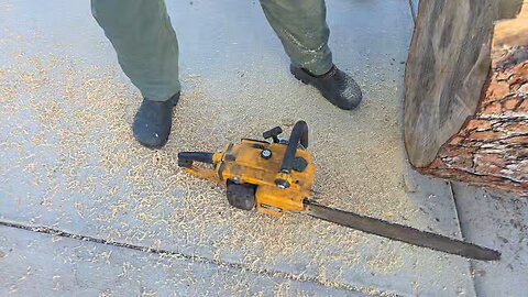 Playing with a menacing old school chainsaw.