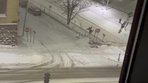 Urban Snowboarder Lands a Jump