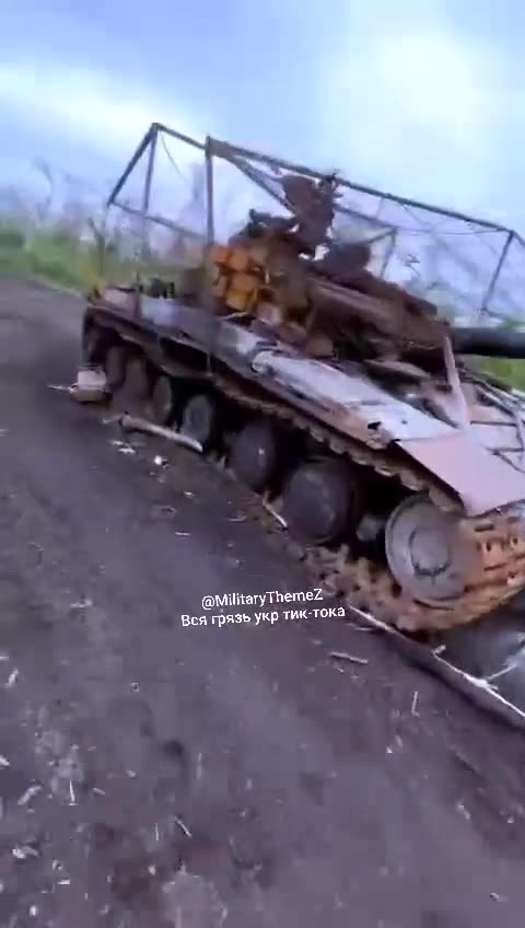A destroyed T-64BV tank with a barbecue grill in one of the areas