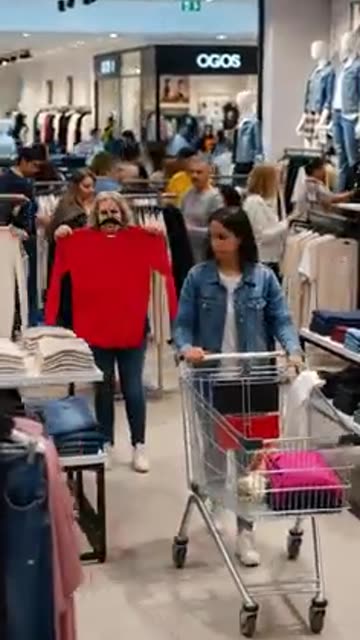 People in The Mall Store shopping For clothes