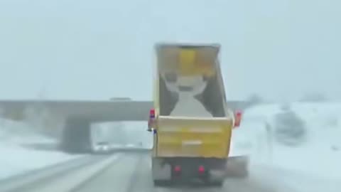 Indian driver strikes a bridge with his snow plow in Barrie, Ontario.