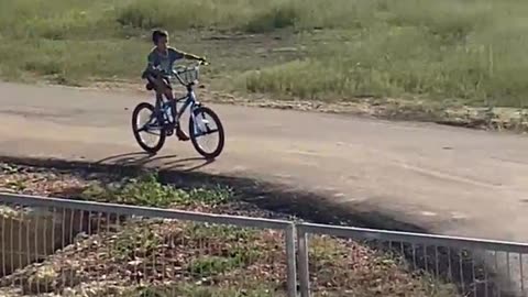 Young Bicycle Rider Crashes Into Closed Gate