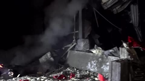 Rescuers respond after missile barrage hits Ukraine's Kharkiv