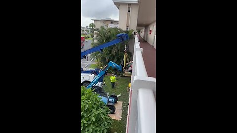 Florida Firefighters' Jaw-Dropping Crane Rescue: 600lb Man Lowered from Balcony in Emergency Op!