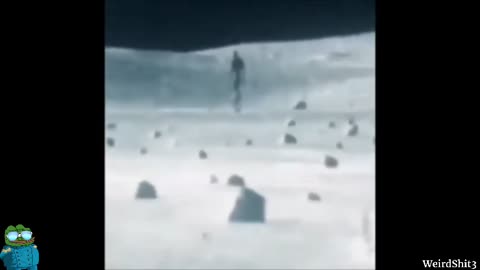 6 MILE HIGH HUMANOID FIGURE ON THE LUNAR SURFACE LOOKING RIGHT AT THE CAMERA