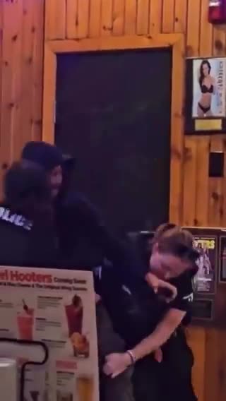 video at Hooters' restaurant raises a brutal question for police departments - policy or reality?