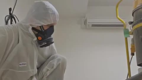 Long day of grinding asbestos work in the city