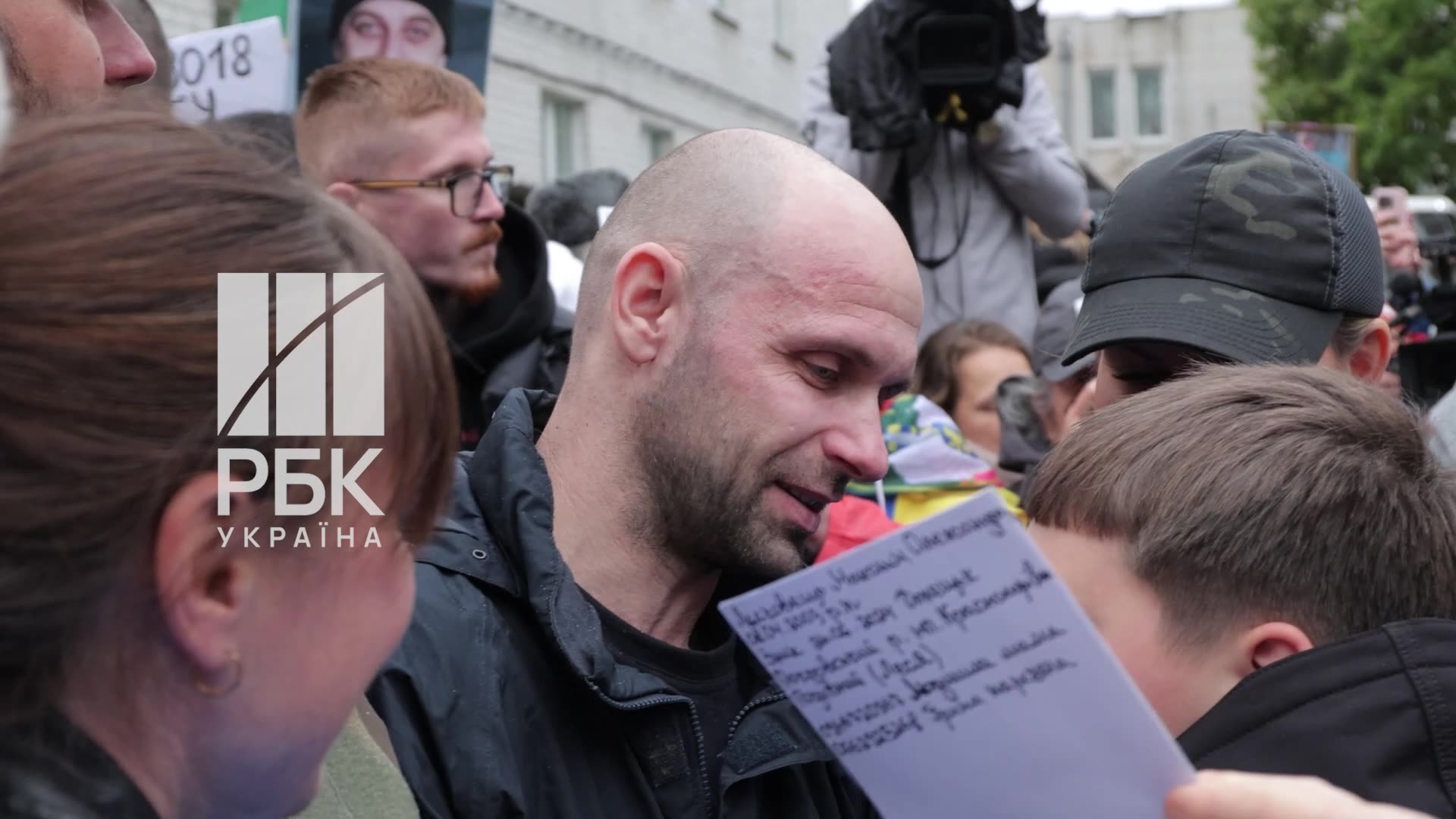 Soldier after years in captivity, holds his child in his arms for the first time.