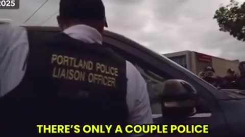 A Portland police officer threatens a ICE thug with arrest