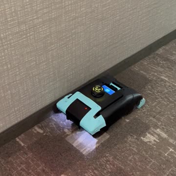Robotic Vacuum in Staybridge Hallway