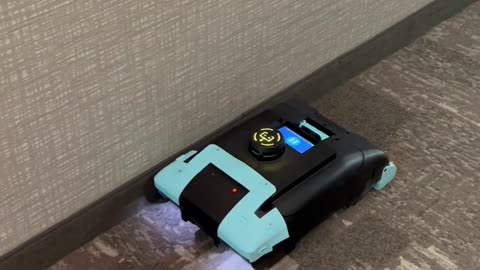 Robotic Vacuum in Staybridge Hallway