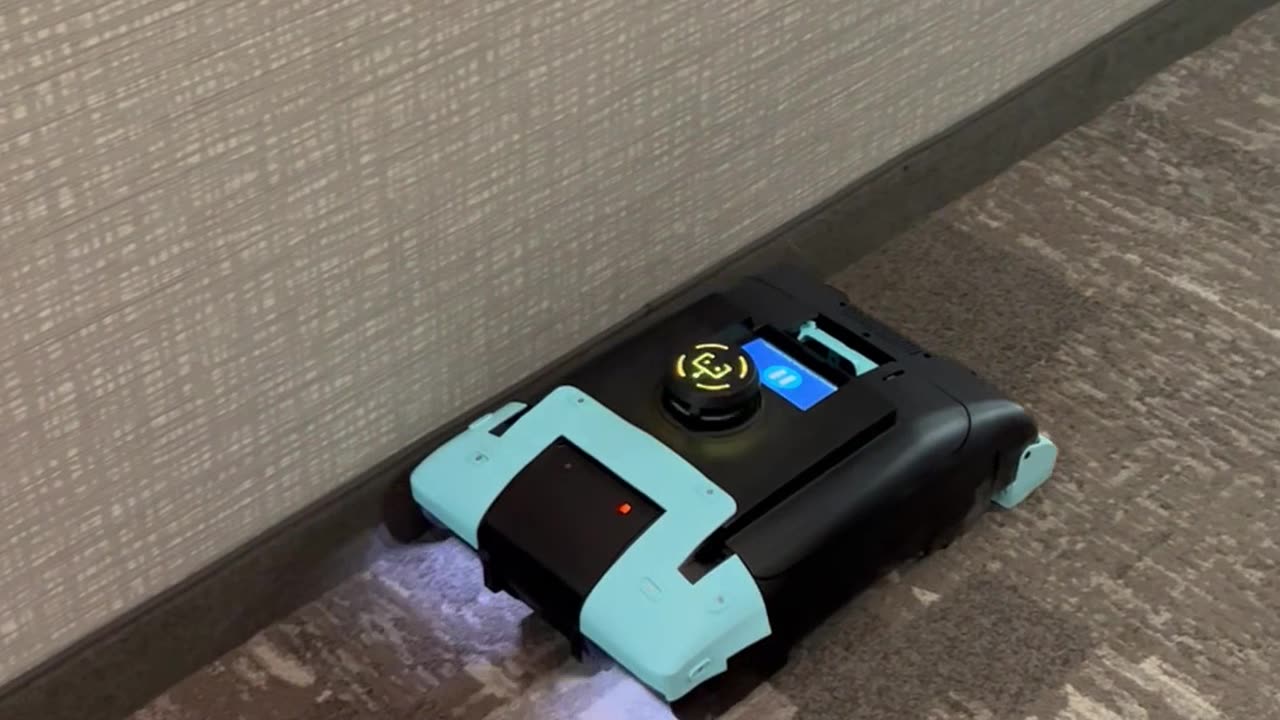 Robotic Vacuum in Staybridge Hallway