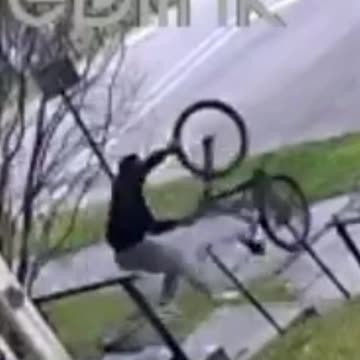 Man in Hoodie Seen Taking Bicycle from Residential Property