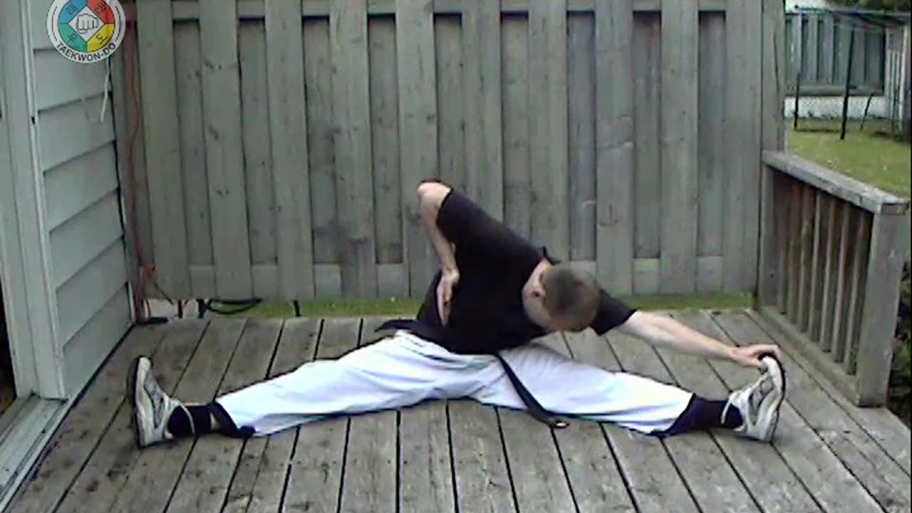 Warm-ups: 25-sitting-with-legs-apart-hand-to-foot-and-head-to-knee-front-view
