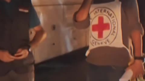 Ahead of the terrorists' roundup: Red Cross cars at the entrance to Ofer Prison