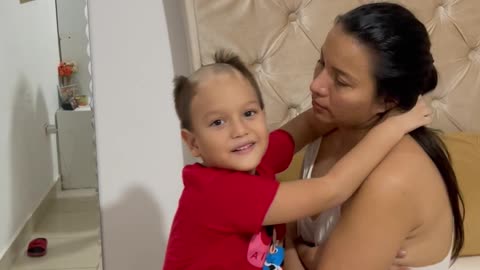 Boy Shaves Head and Shows His Mom