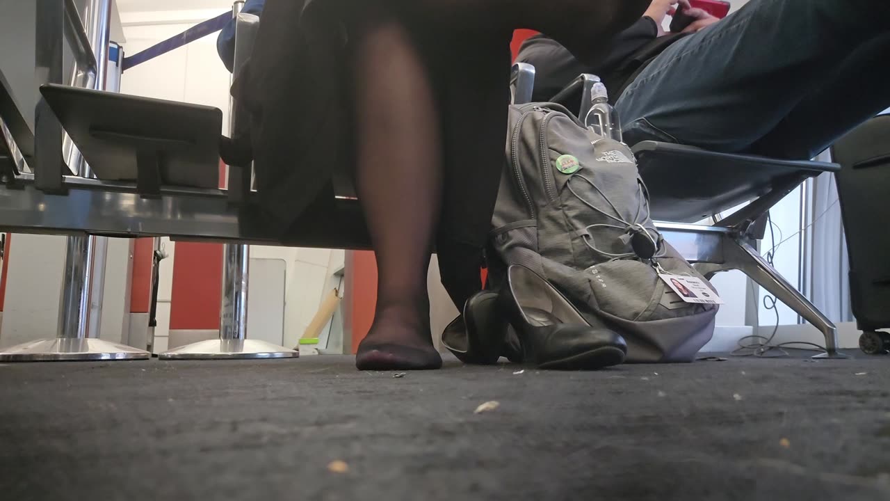 Operation Airhose- passenger takes her spike heels off.