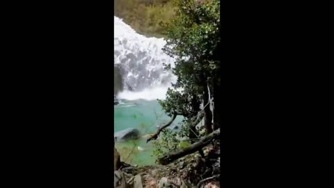 Massive avalanche rolling down a valley