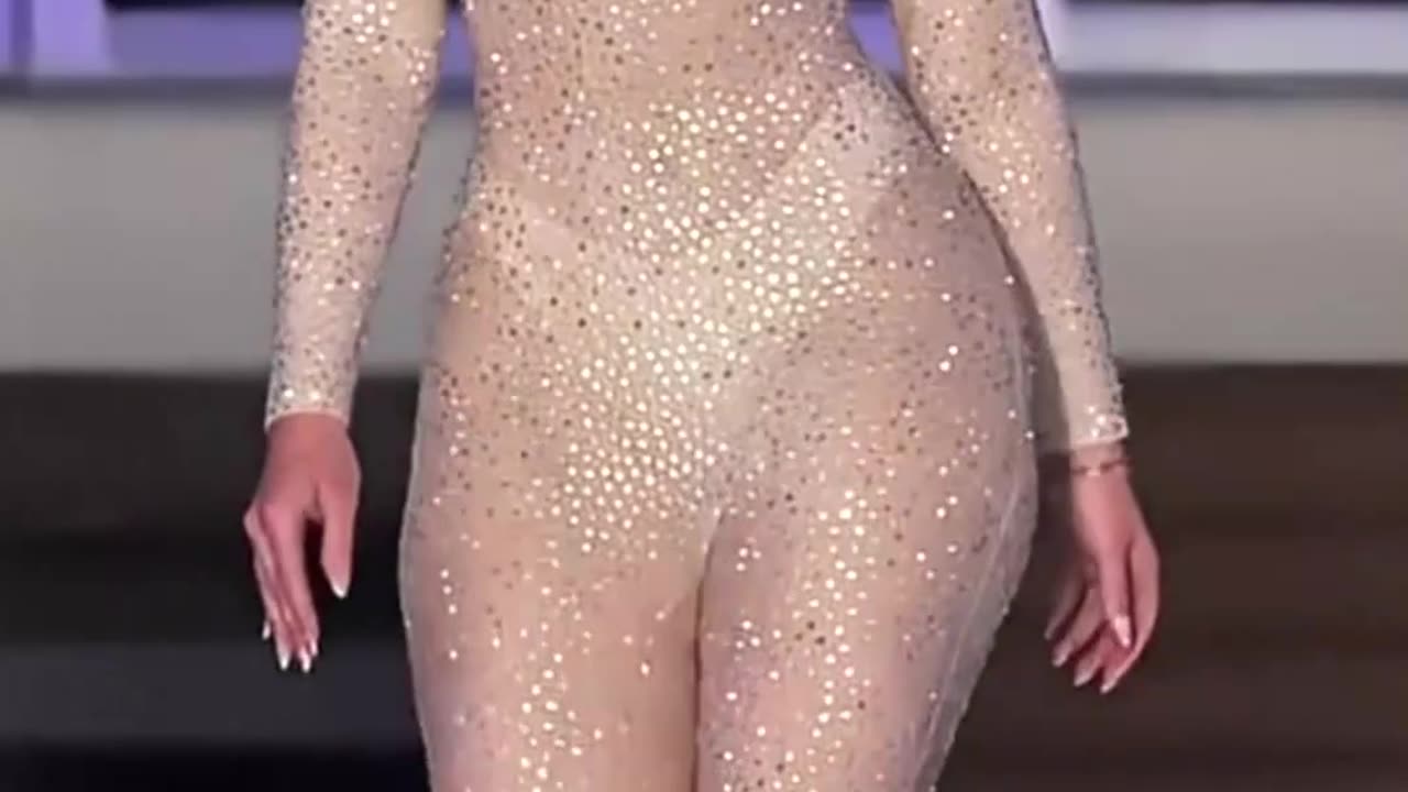 This glitter jumpsuit shines like a diamond on the runway ✨