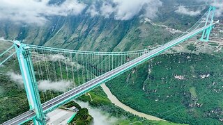 World's highest bridge opens to traffic in China. Footage over the Raimbow...