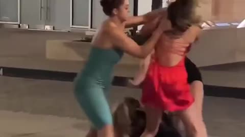 The two in black. What is happening