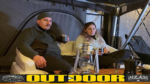 The couple drives into the forest, setting up a camping tent in the snow and enjoying outdoor life