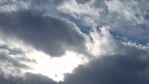 "Clouds" in the atmosphere blocking the white sun(blue hue) and the yellow sun