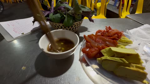 Eating jellyfish and rooster testicles at Soy 5 Ma May in Hanoi, Vietnam