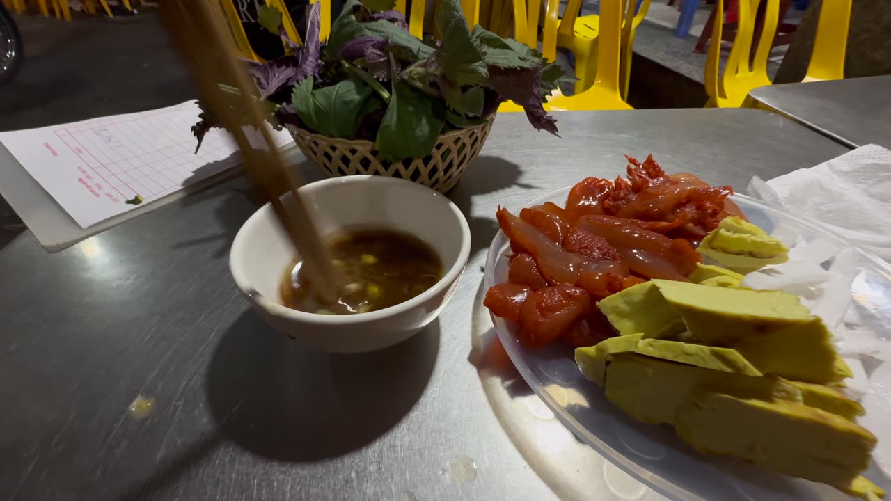 Eating jellyfish and rooster testicles at Soy 5 Ma May in Hanoi, Vietnam