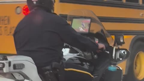 Cop Watching Baseball Game on Motorcycle