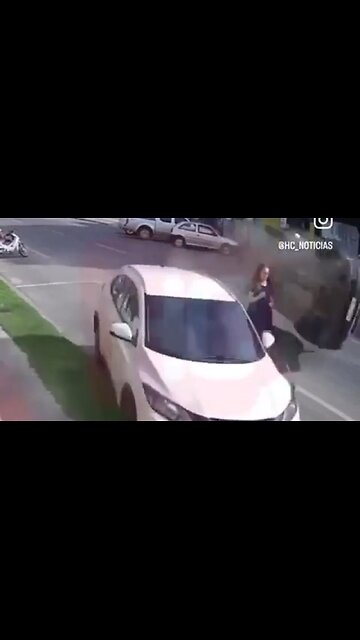 Clueless Woman Walking In The Middle Of Street Instead Of The Sidewalk Causes The Craziest Accident