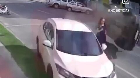 Clueless Woman Walking In The Middle Of Street Instead Of The Sidewalk Causes The Craziest Accident